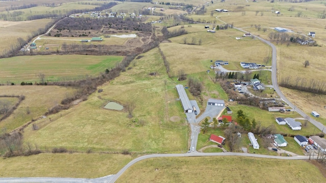 birds eye view of property with a rural view