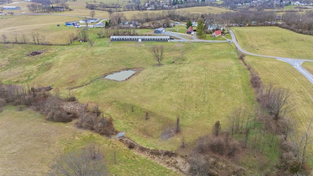 birds eye view of property featuring a rural view