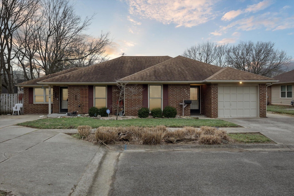 ranch-style home featuring a garage