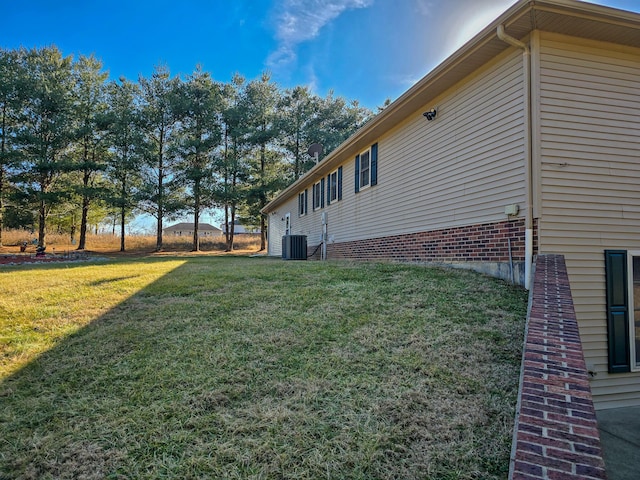 view of yard featuring central AC unit