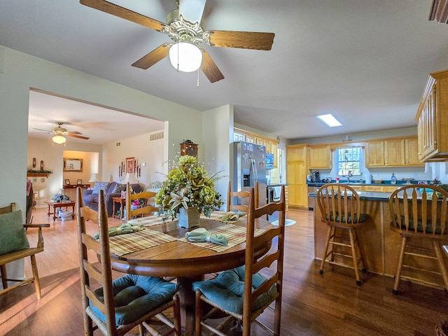 dining area with dark hardwood / wood-style flooring