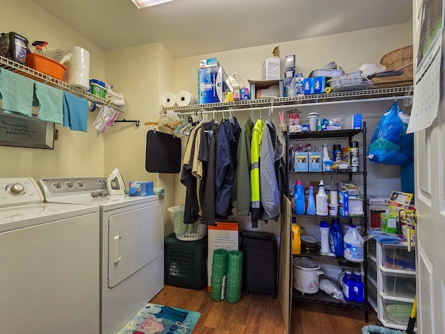 laundry room with separate washer and dryer and dark hardwood / wood-style flooring