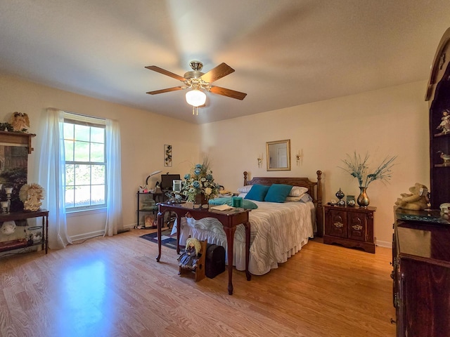 bedroom featuring light hardwood / wood-style flooring and ceiling fan