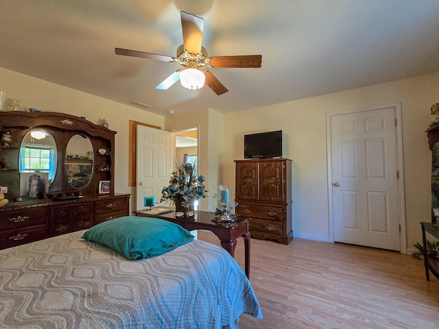 bedroom featuring light hardwood / wood-style flooring and ceiling fan