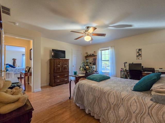 bedroom with light hardwood / wood-style flooring and ceiling fan