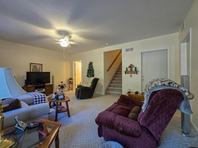 living room featuring light carpet and ceiling fan