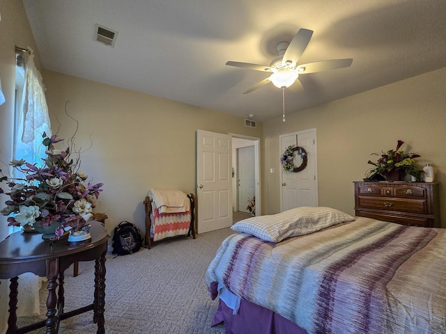 carpeted bedroom with ceiling fan