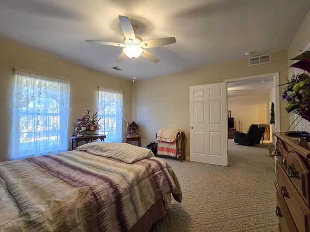 carpeted bedroom featuring ceiling fan