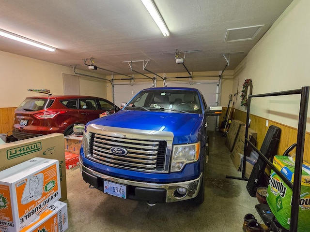 garage with wood walls