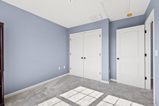 unfurnished bedroom featuring a closet and carpet flooring