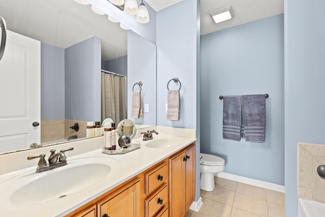 bathroom with toilet, tile patterned floors, a tub to relax in, and vanity