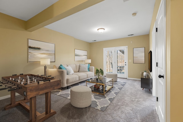 living room featuring carpet flooring and beam ceiling