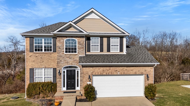 view of front of house with a garage and a front lawn