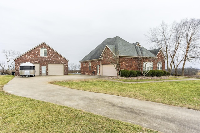 view of front of home featuring a garage, brick siding, and a front lawn