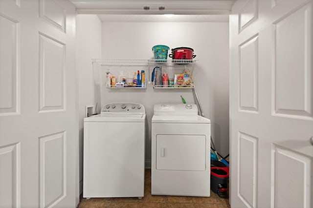 clothes washing area with washer and dryer