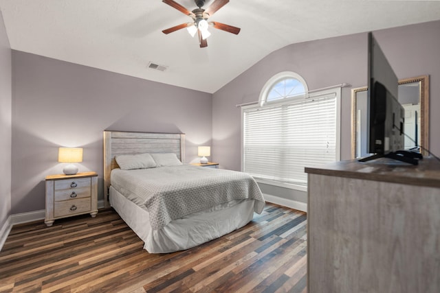 bedroom with vaulted ceiling, ceiling fan, and dark hardwood / wood-style flooring