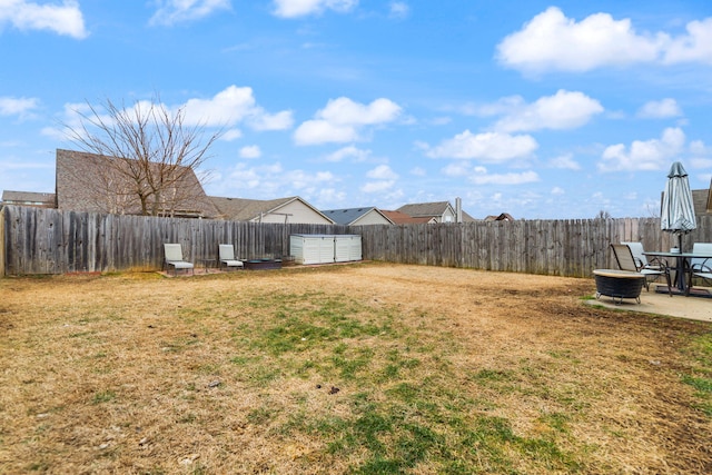 view of yard featuring a patio area and a fire pit