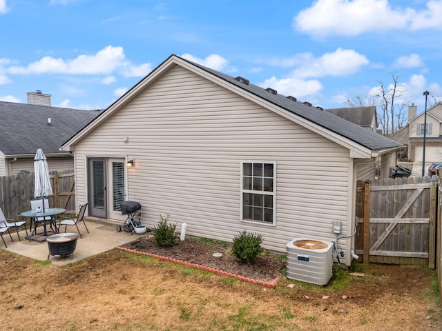 back of house with a patio