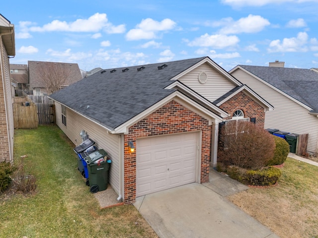 view of front of house with a garage and a front lawn