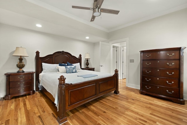 bedroom featuring baseboards, a ceiling fan, light wood-style flooring, crown molding, and recessed lighting