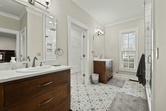 bathroom featuring two vanities, crown molding, and tile patterned floors