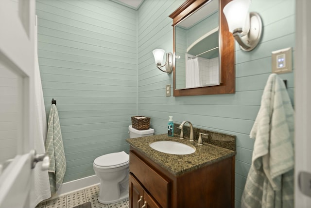 bathroom featuring toilet, shower / tub combo, and vanity