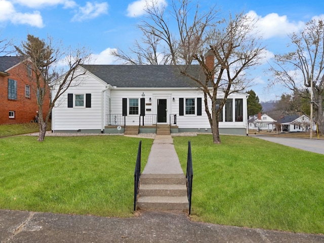 view of front of house featuring crawl space, a chimney, a front lawn, and roof with shingles