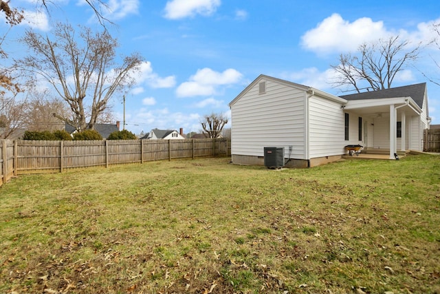 view of yard featuring a fenced backyard and central AC unit