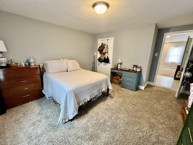 carpeted bedroom with a closet