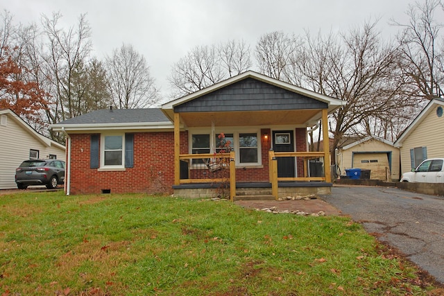 view of front facade featuring a porch, a garage, and a front yard