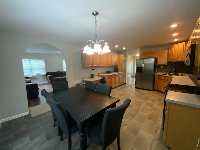 251 A Duncan Rd, Strunk, KY 42649 - dining space featuring arched walkways, a chandelier, recessed lighting, and light tile patterned flooring