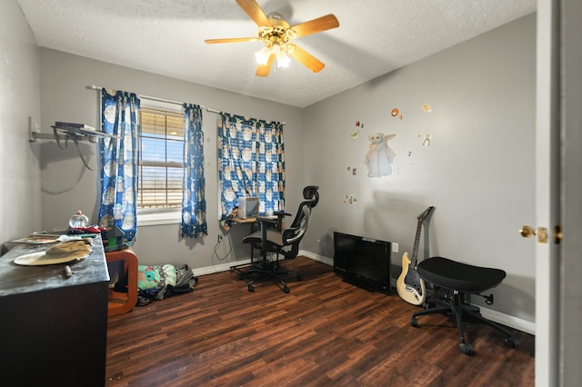 office featuring ceiling fan, dark hardwood / wood-style flooring, and a textured ceiling