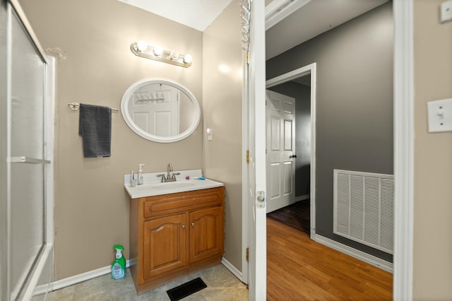 bathroom featuring vanity and hardwood / wood-style floors