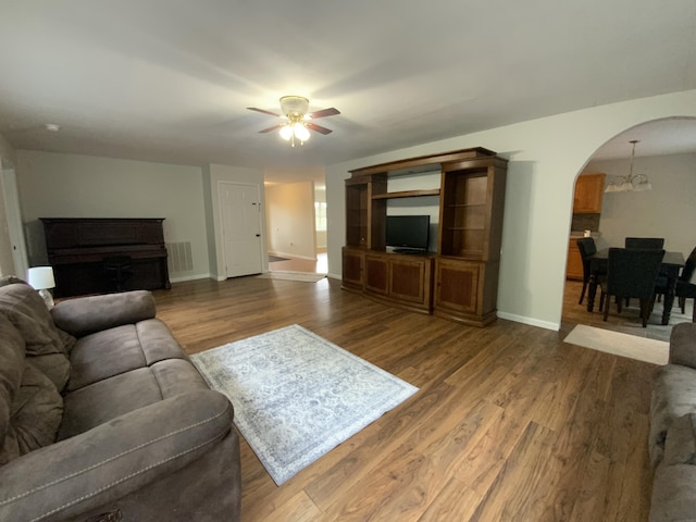 251 A Duncan Rd, Strunk, KY 42649 - living room with a ceiling fan, arched walkways, and wood finished floors