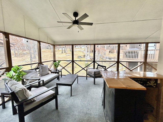 sunroom / solarium with vaulted ceiling and ceiling fan