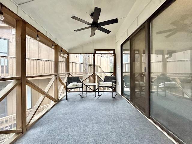 sunroom / solarium featuring vaulted ceiling and ceiling fan