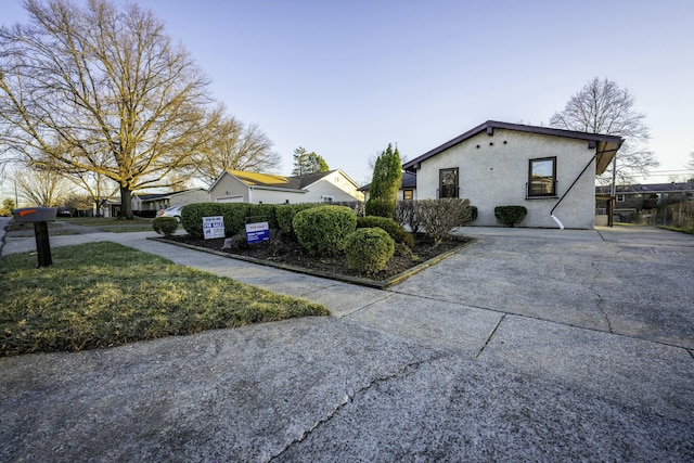 view of side of property with stucco siding