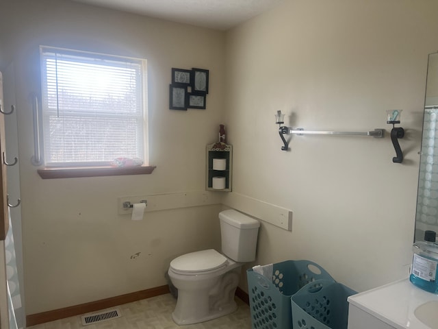 bathroom with vanity and toilet