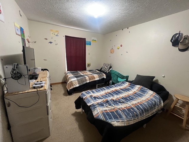 carpeted bedroom featuring a textured ceiling