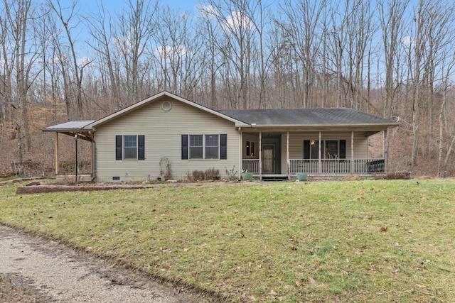 ranch-style home featuring covered porch and a front lawn