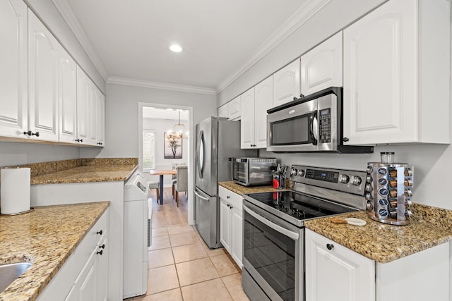 kitchen featuring crown molding, appliances with stainless steel finishes, stone countertops, and white cabinets