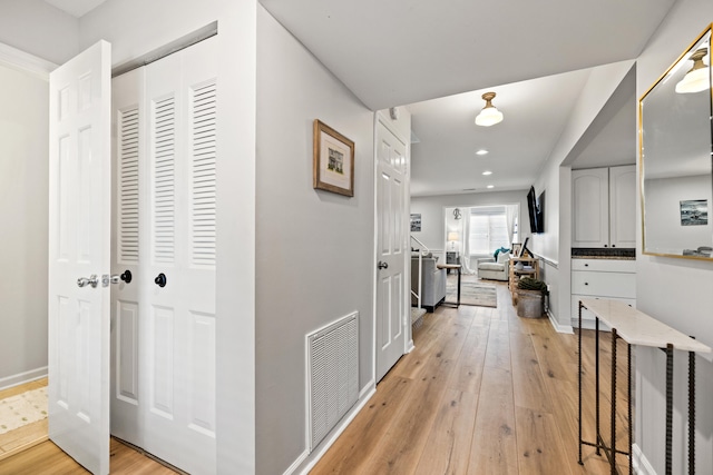 hallway featuring light hardwood / wood-style flooring