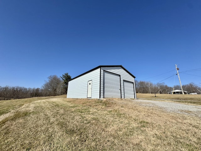 garage featuring a yard