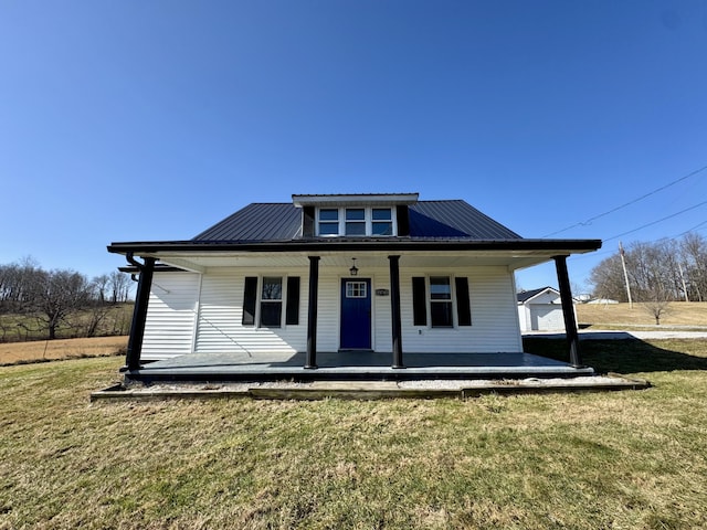 view of front of home with a porch and a front yard