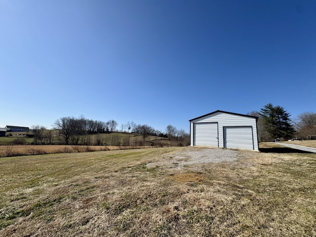 garage featuring a yard