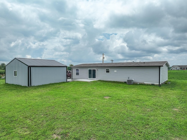 back of property featuring a yard, a patio, and central air condition unit