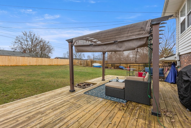 wooden deck featuring a lawn and a pergola