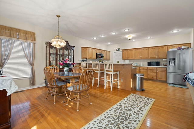 dining area with light wood-type flooring