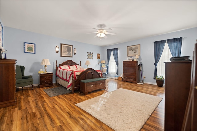 bedroom featuring ceiling fan and dark hardwood / wood-style floors