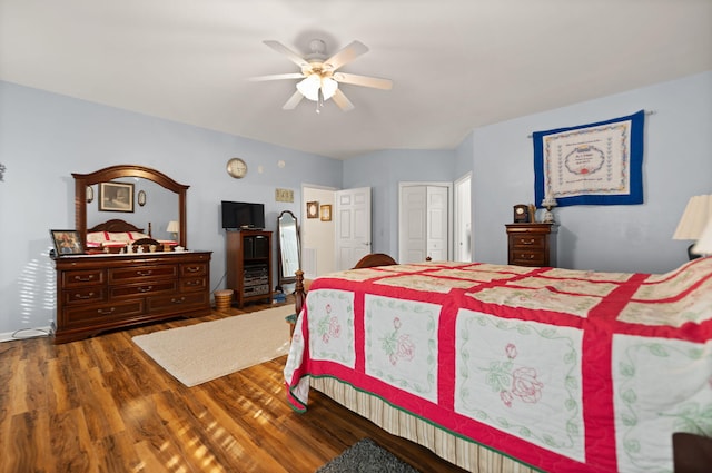 bedroom with hardwood / wood-style flooring, a closet, and ceiling fan
